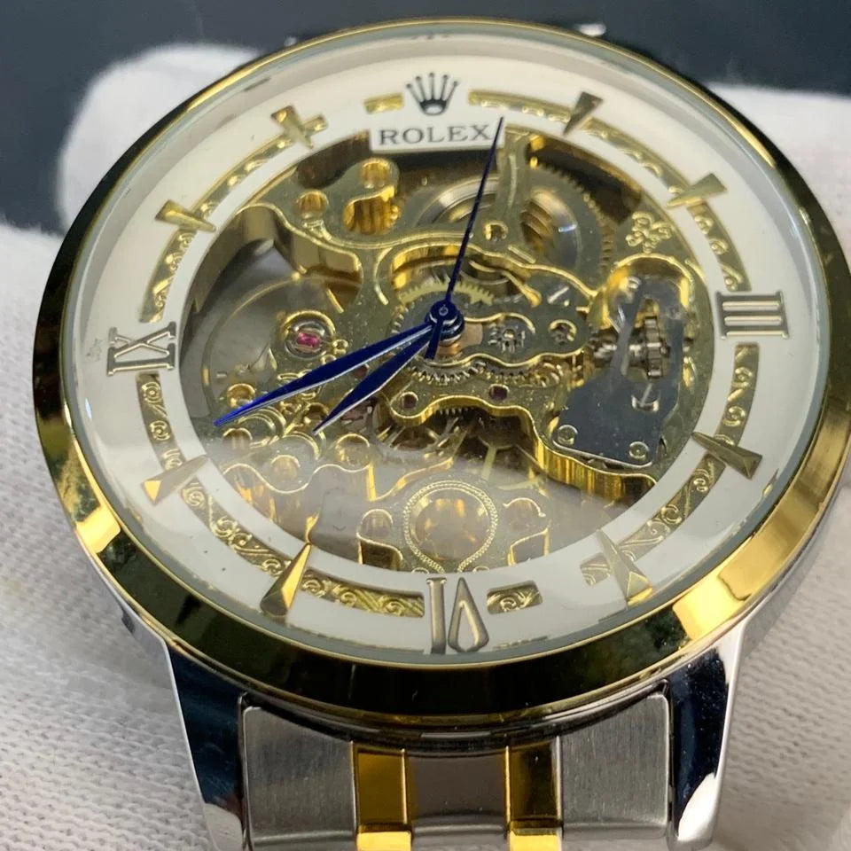 Luxury watch with gold and silver design on a white background